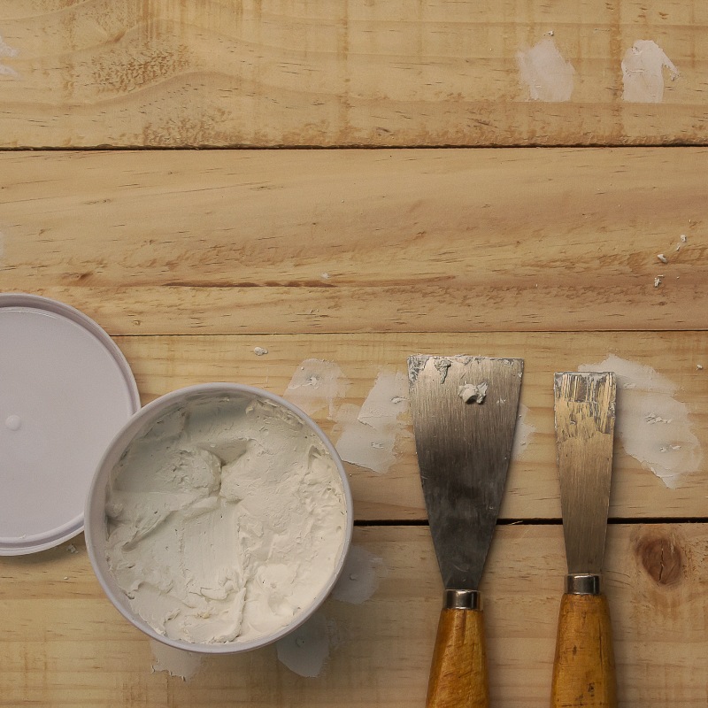 Putty knife and the wooden floor littleton co