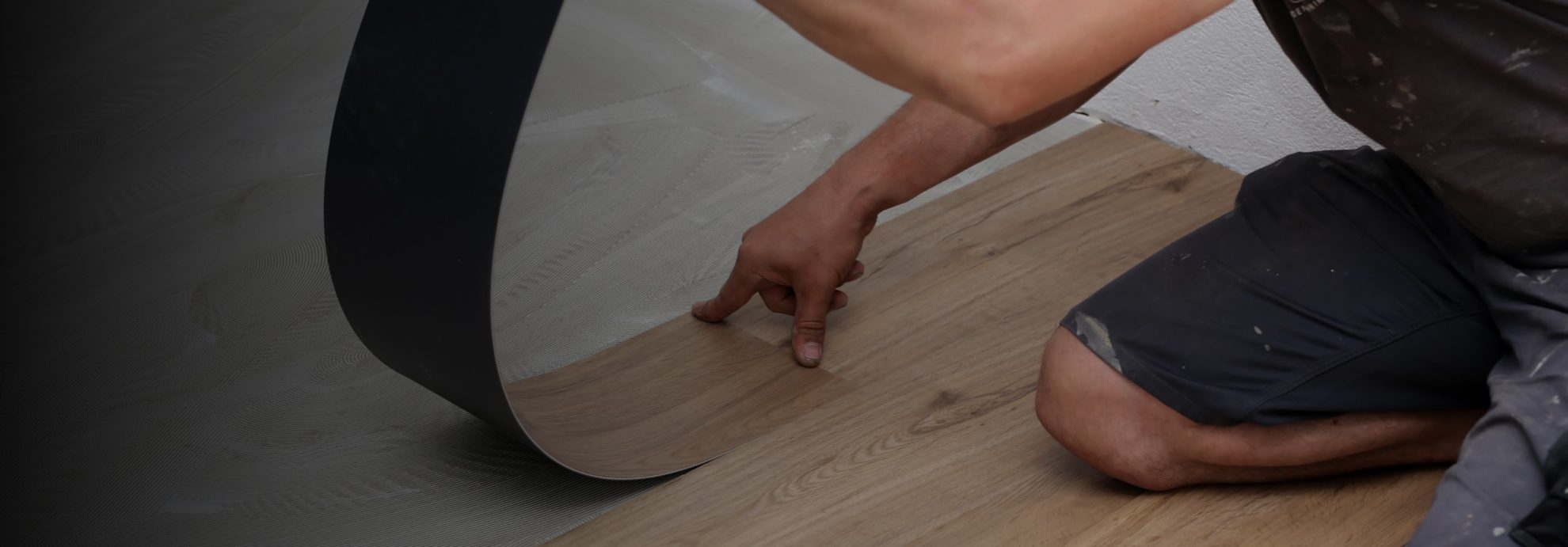 The worker installing new vinyl tile floor in littleton co